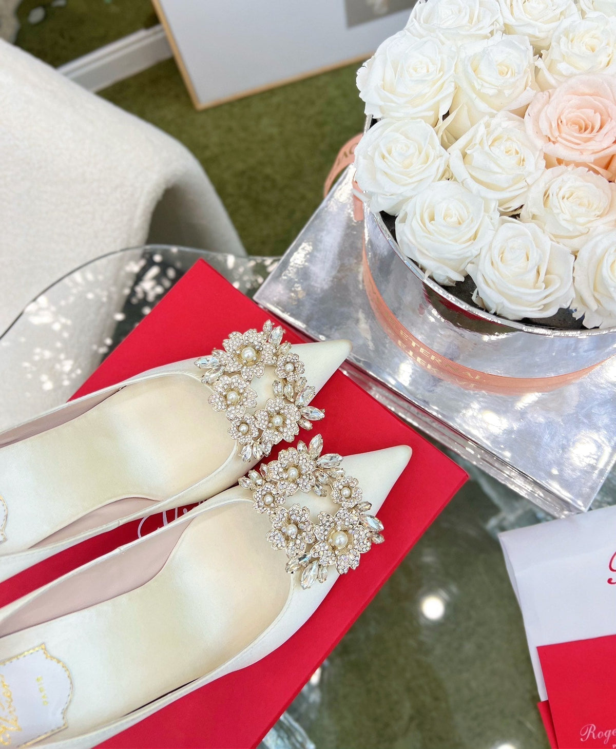 EFFLORESCENCE POINTED-TOE PUMPS IN WHITE SATIN WITH CRYSTAL BUCKLE