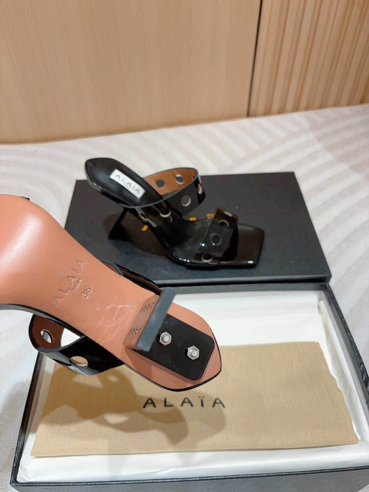 ALAIA TWO-STRAPS HIGH HEEL SANDALS IN BLACK PATENT LAMBSKIN