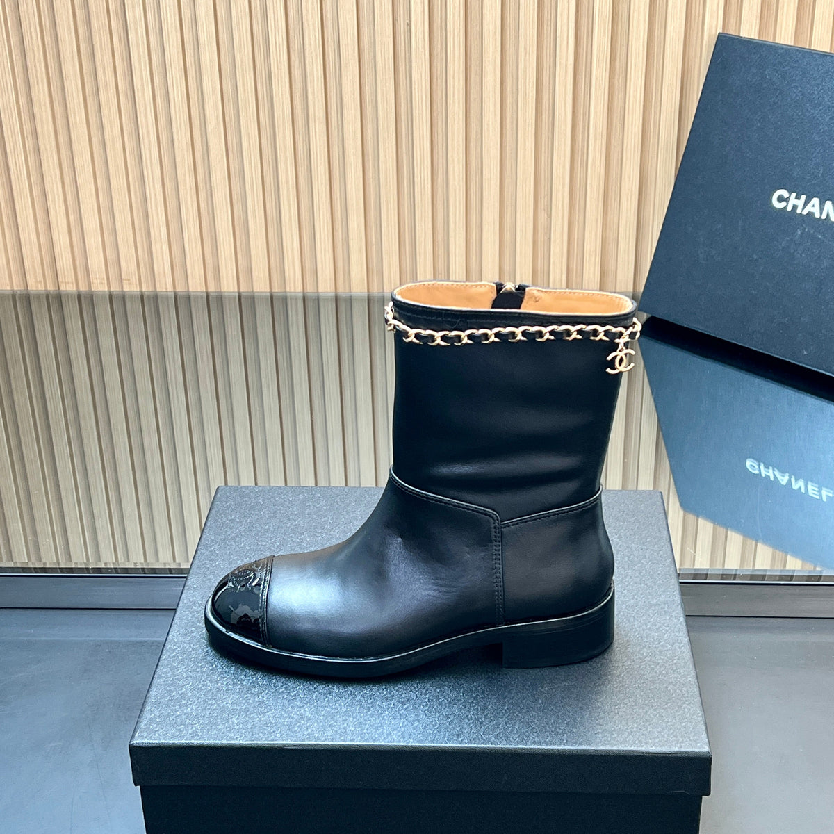 CHANEL 25S SHORT BOOTS WITH CHAIN IN BLACK CALFSKIN