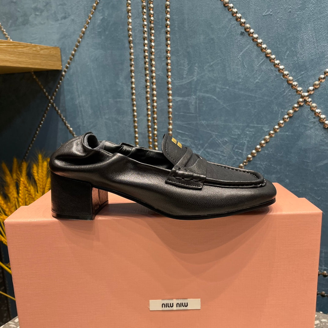 HIGH BROGUE LOAFERS IN BLACK LAMBSKIN