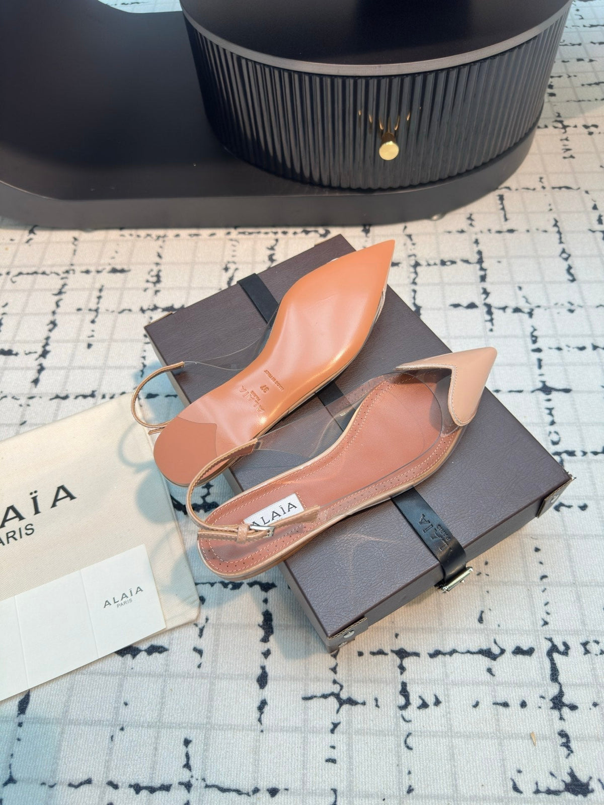 ALAIA FLAT SLINGBACK IN BEIGE BISQUE PATENT CALFSKIN AND FILM