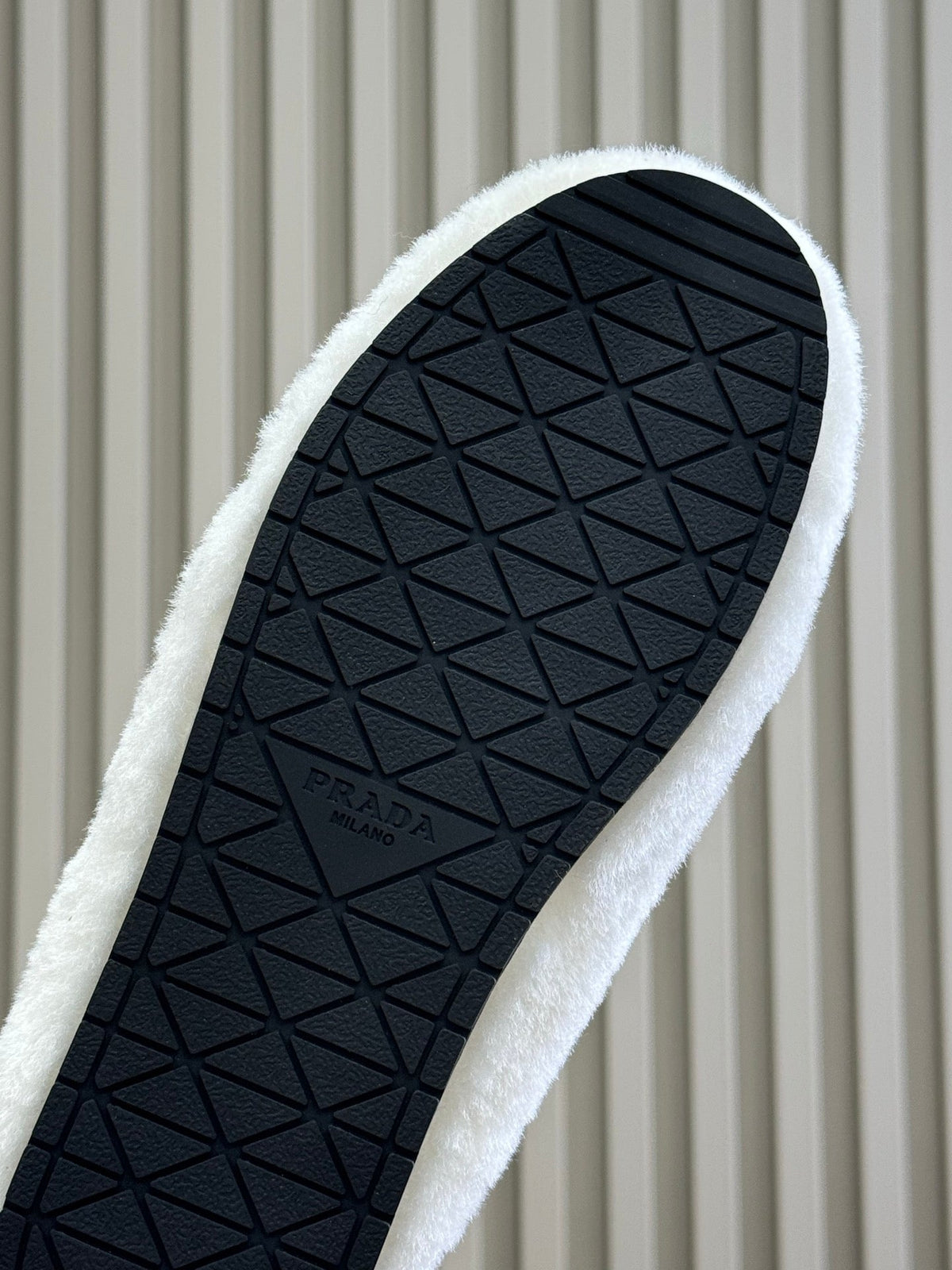 PRADA 25S CLOGS IN WHITE SHEARLING