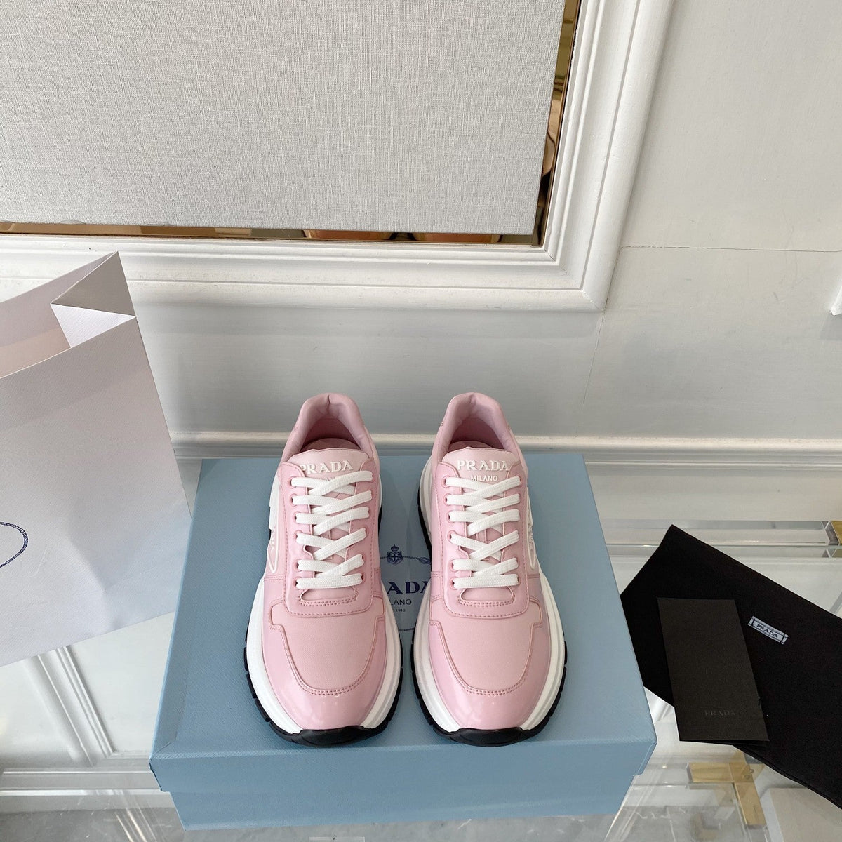 PRADA 25S THICK SOLE SNEAKER IN LIGHT PINK CALFSKIN AND CANVAS