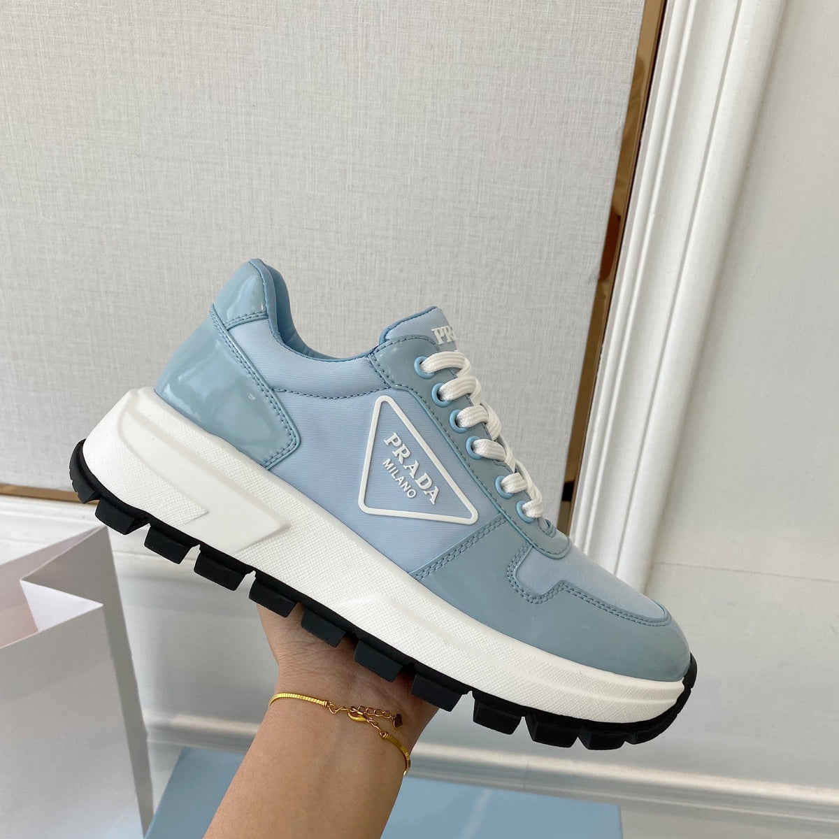 PRADA 25S THICK SOLE SNEAKER IN LIGHT BLUE CALFSKIN AND CANVAS