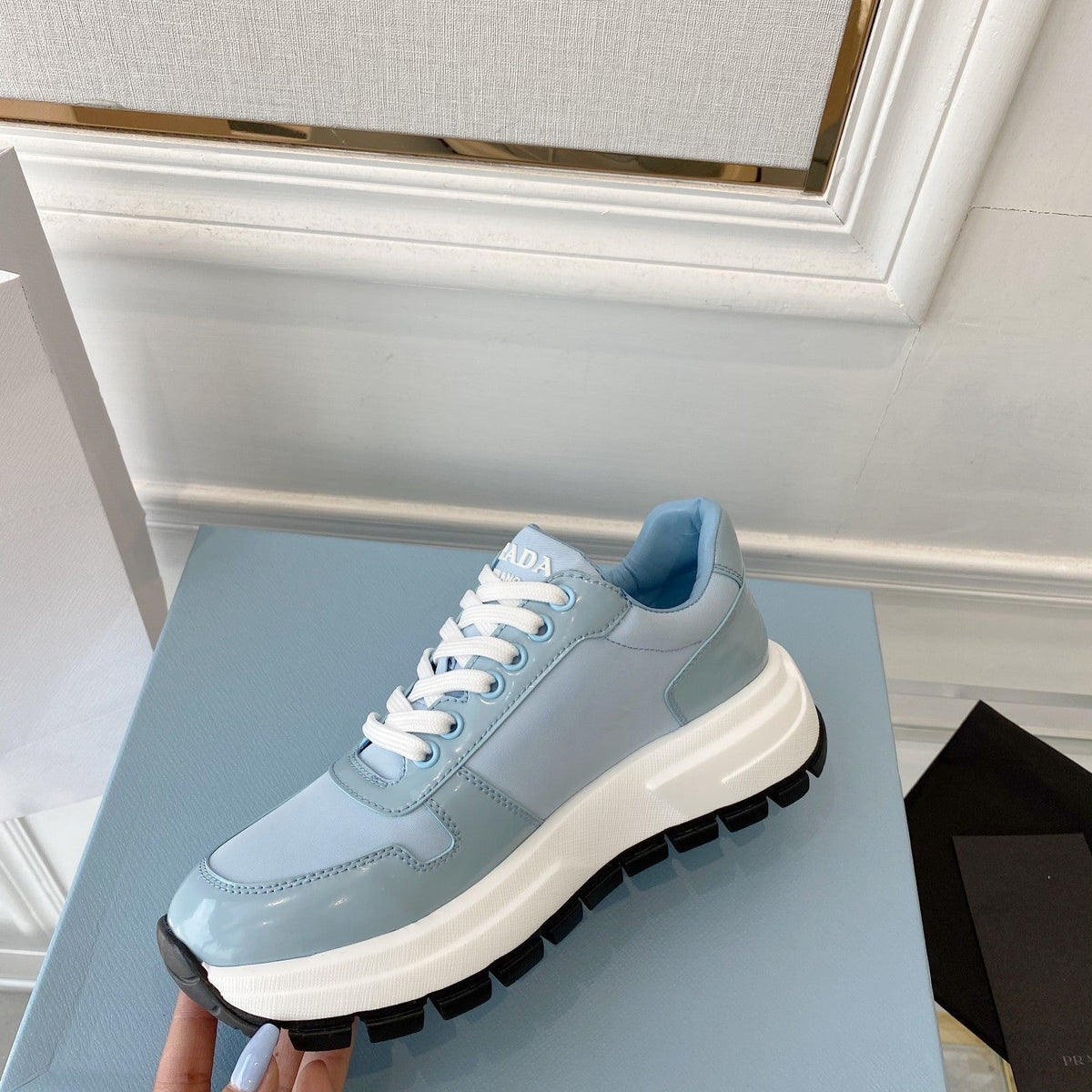 PRADA 25S THICK SOLE SNEAKER IN LIGHT BLUE CALFSKIN AND CANVAS