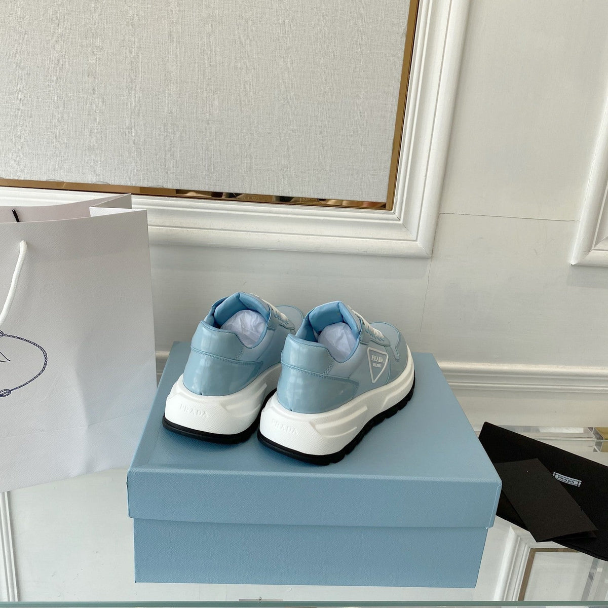 PRADA 25S THICK SOLE SNEAKER IN LIGHT BLUE CALFSKIN AND CANVAS