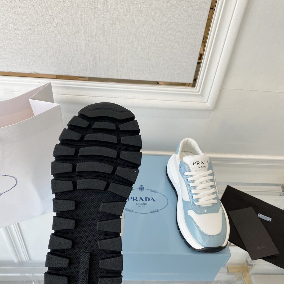 PRADA 25S THICK SOLE SNEAKER IN WHITE AND LIGHT BLUE CALFSKIN