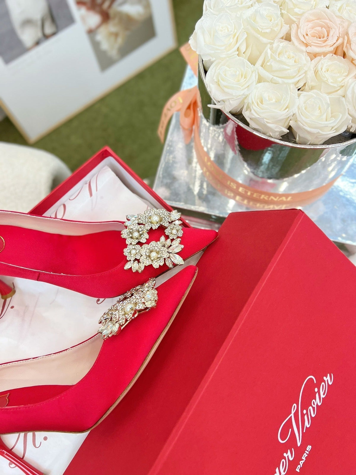 EFFLORESCENCE POINTED-TOE PUMPS IN RED SATIN WITH CRYSTAL BUCKLE