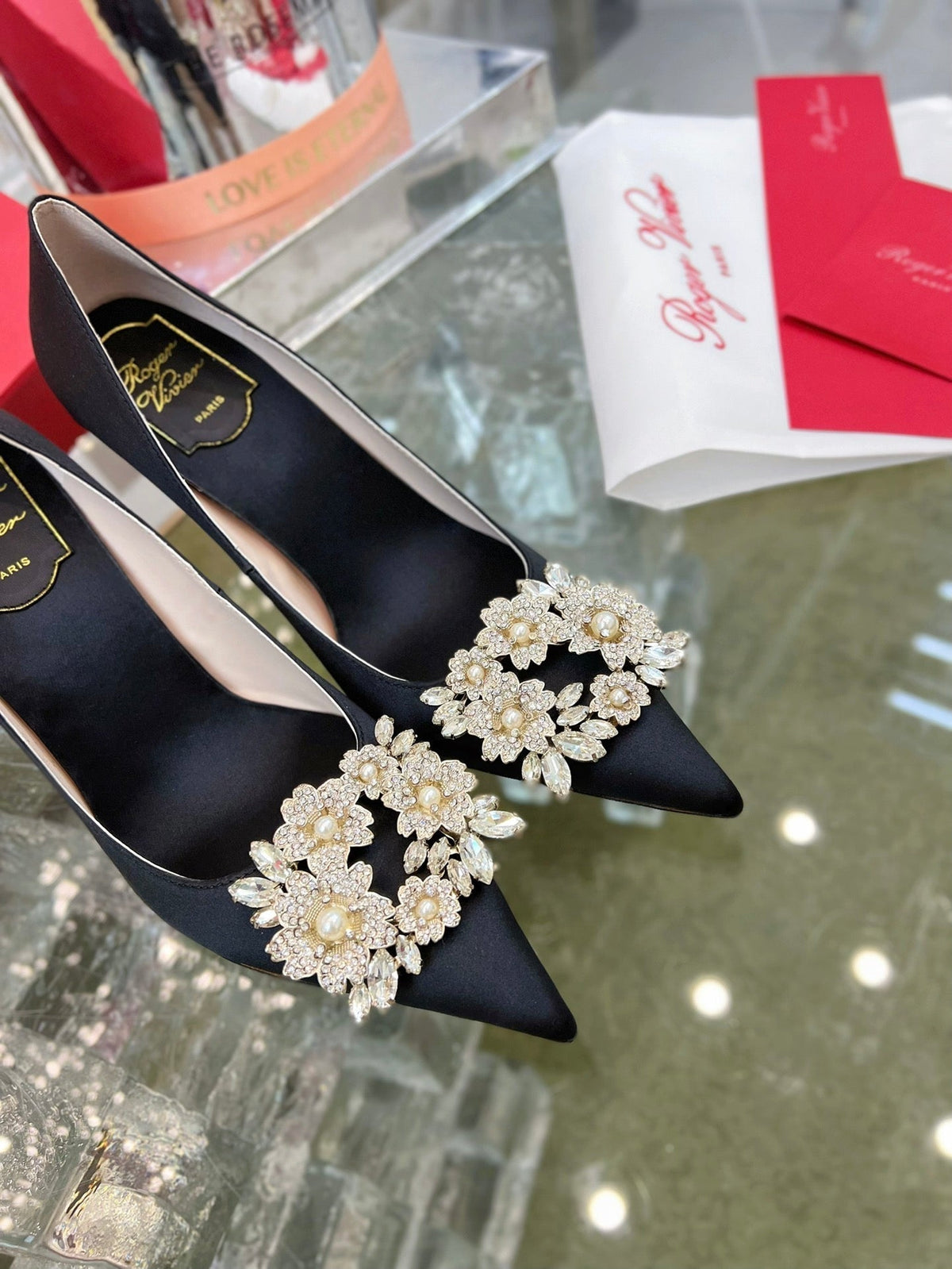EFFLORESCENCE POINTED-TOE PUMPS IN BLACK SATIN WITH CRYSTAL BUCKLE