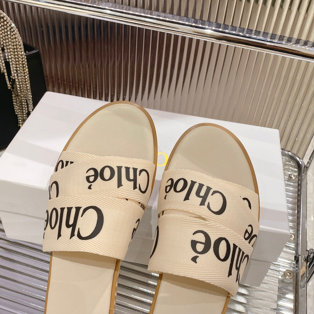 WOODY SLIPPER IN BEIGE MIX BLACK CANVAS