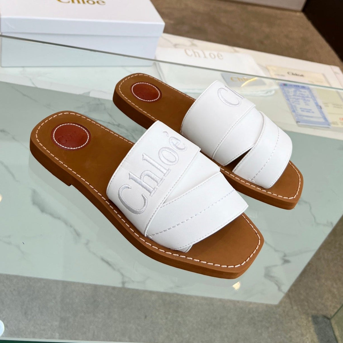 WOODY MULE IN WHITE LAMBSKIN WITH EMBROIDERED LOGO