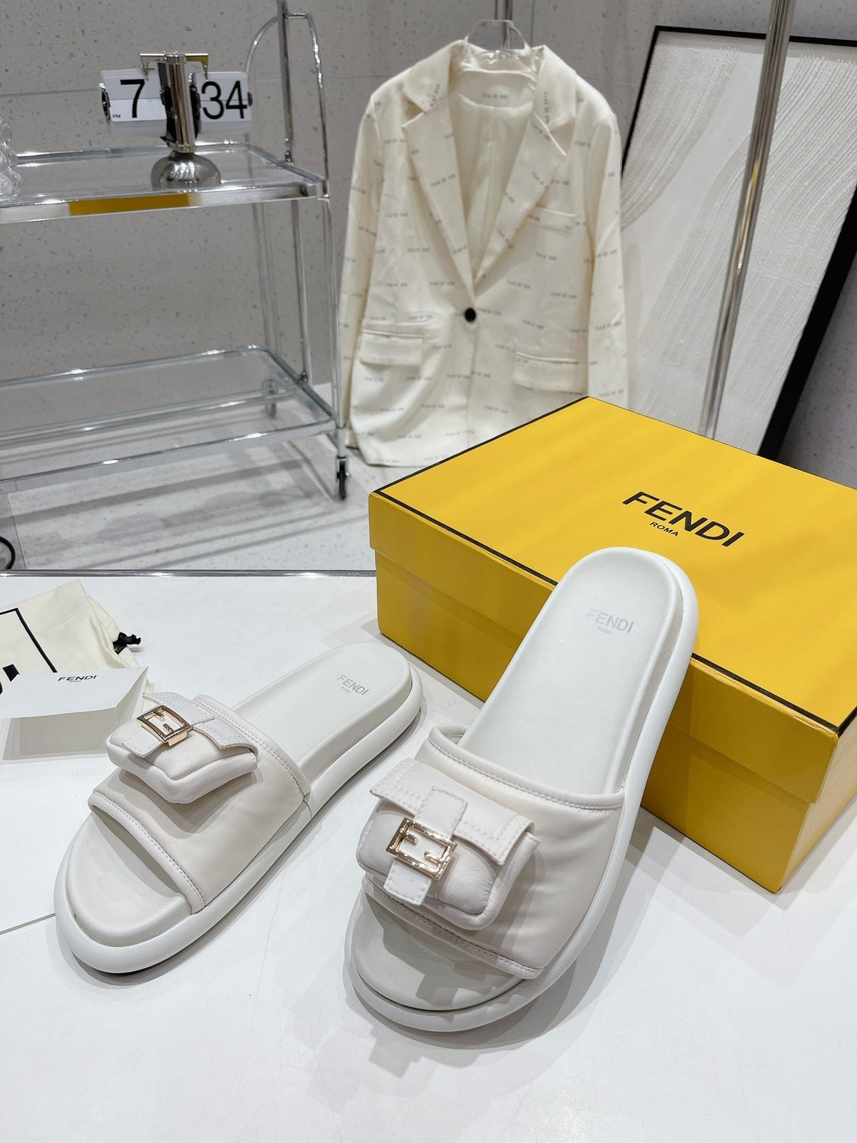 FENDI BAGUETTE SLIPPERS IN WHITE LAMBSKIN WITH GOLD HARDWARE