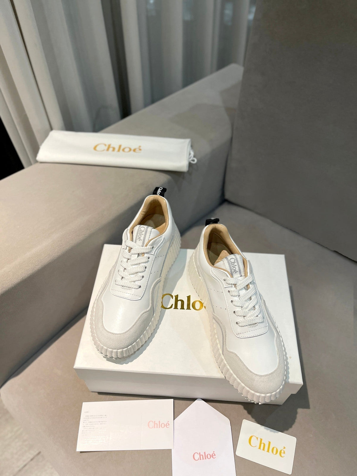 CHLOÉ NAMA SNEAKER IN WHITE LAMBSKIN AND DOVE GREY SUEDE