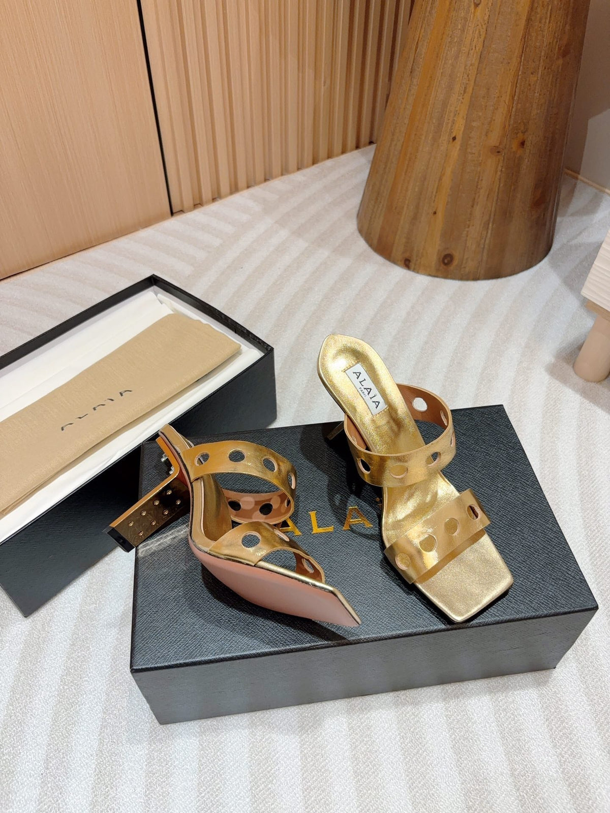 ALAIA TWO-STRAPS HIGH HEEL SANDALS IN GOLDEN PATENT LAMBSKIN