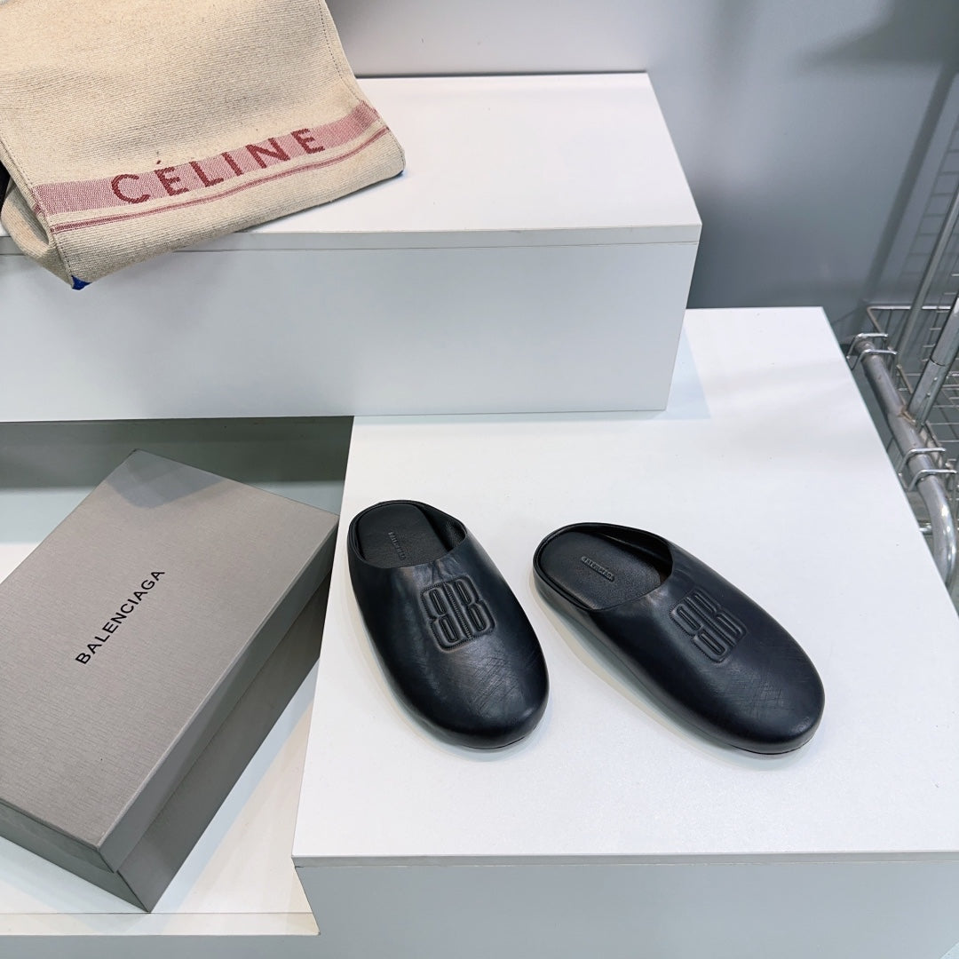 BALENCIAGA 25S MULES IN BLACK LAMBSKIN