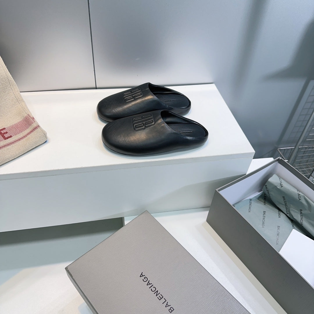 BALENCIAGA 25S MULES IN BLACK LAMBSKIN