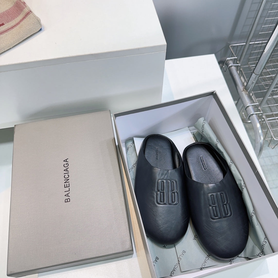 BALENCIAGA 25S MULES IN BLACK LAMBSKIN