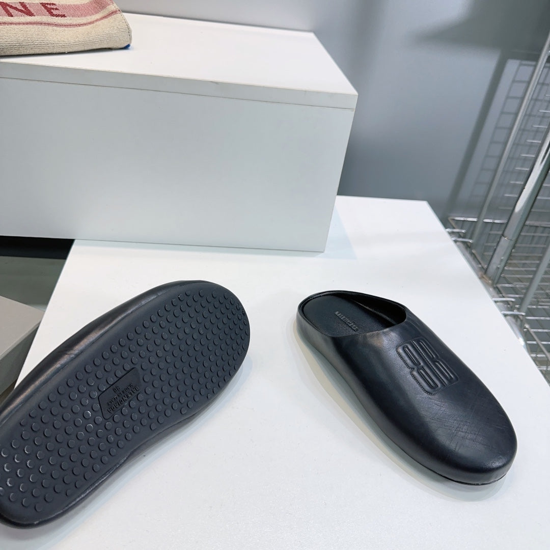 BALENCIAGA 25S MULES IN BLACK LAMBSKIN