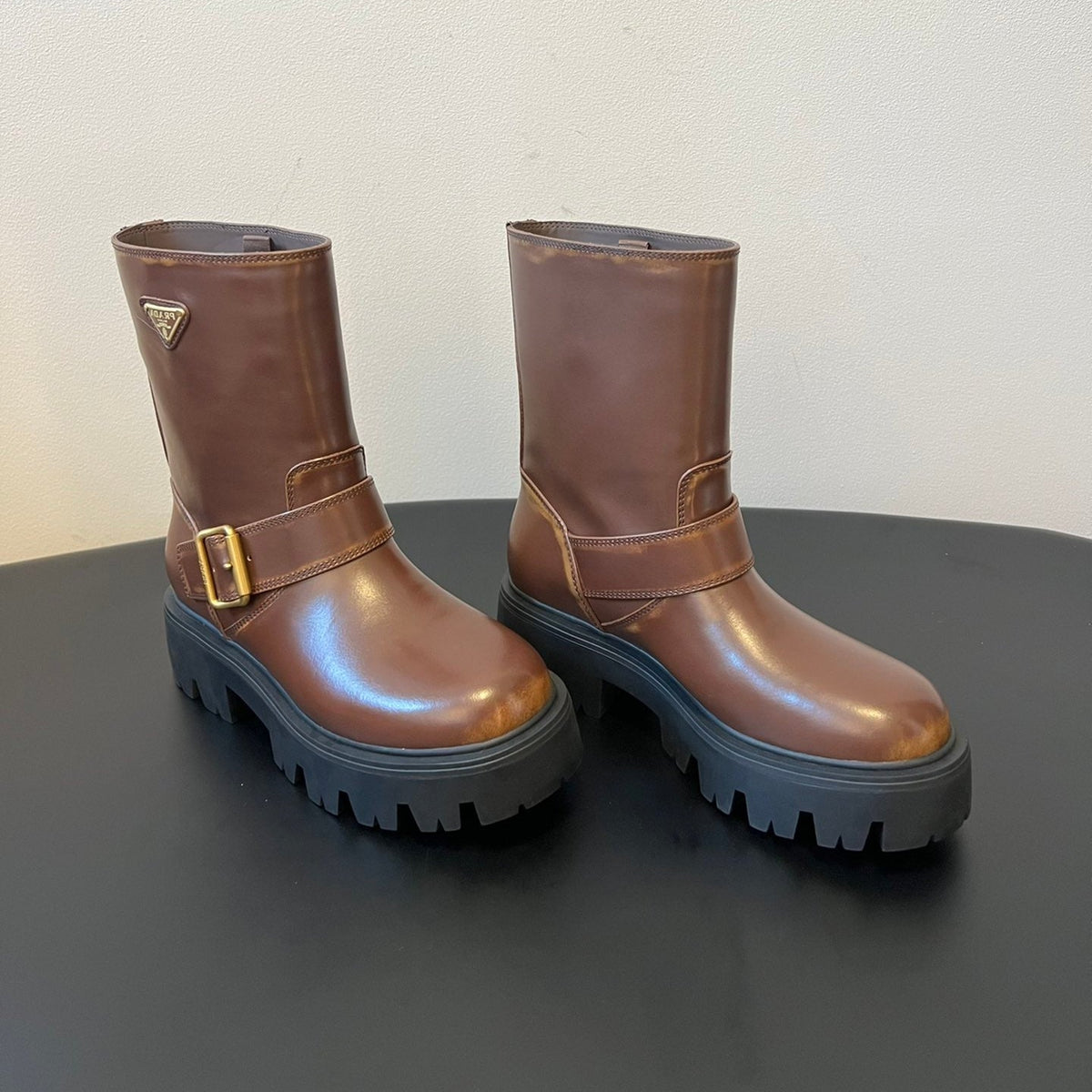 PRADA 25S PLATFORM ANKLE BOOTS IN BROWN CALFSKIN WITH GOLD HARDWARE