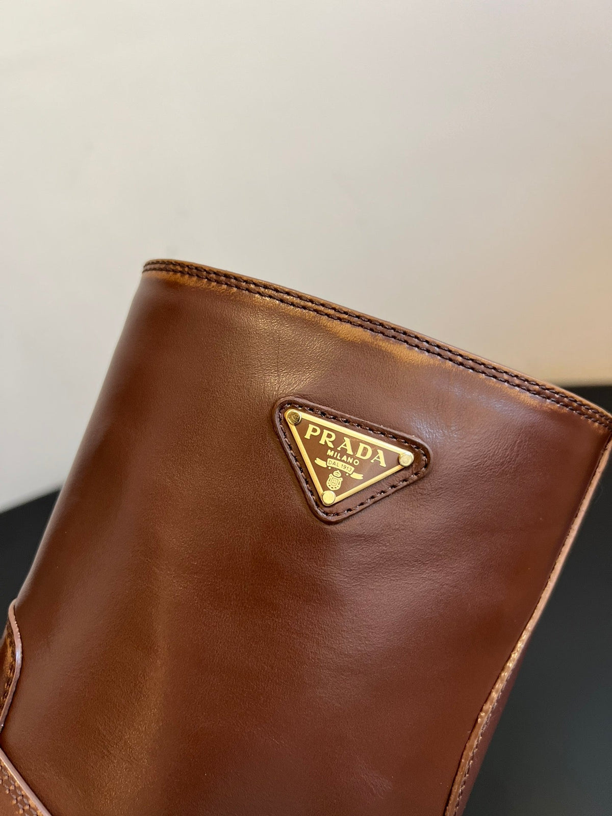 PRADA 25S PLATFORM ANKLE BOOTS IN BROWN CALFSKIN WITH GOLD HARDWARE