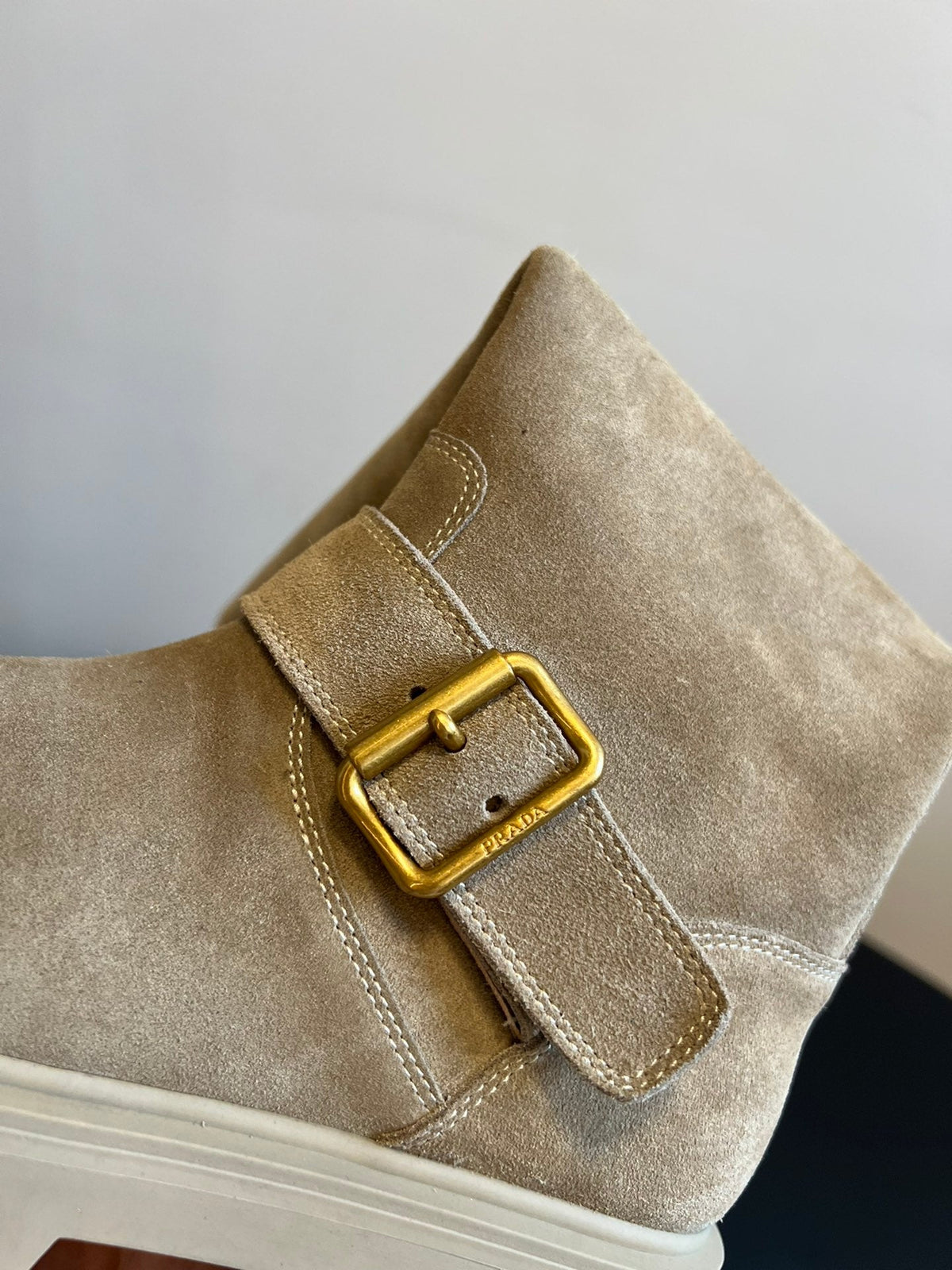 PRADA 25S HIGH-CUT PLATFORM BOOTS IN DARK BEIGE SUEDE WITH GOLD HARDWARE