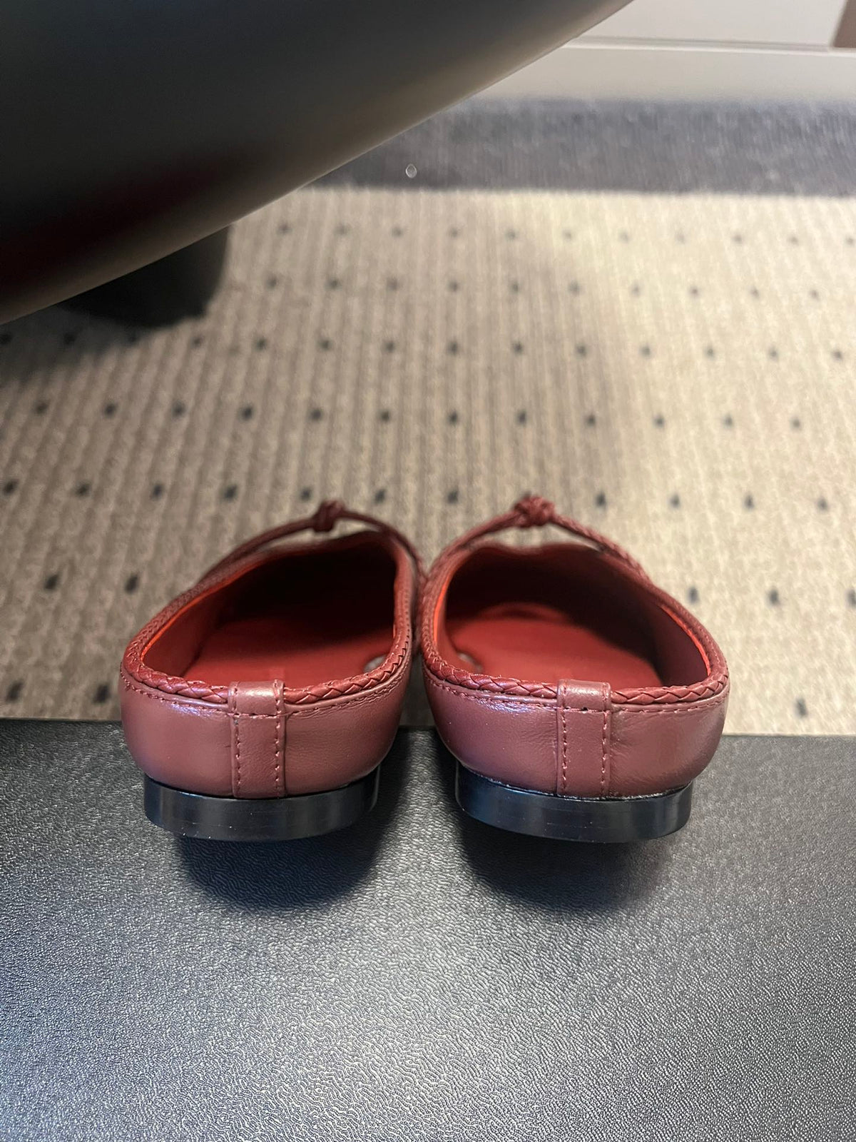 BOTTEGA VENETA 26S FLAT MULES IN DARK RED LAMBSKIN