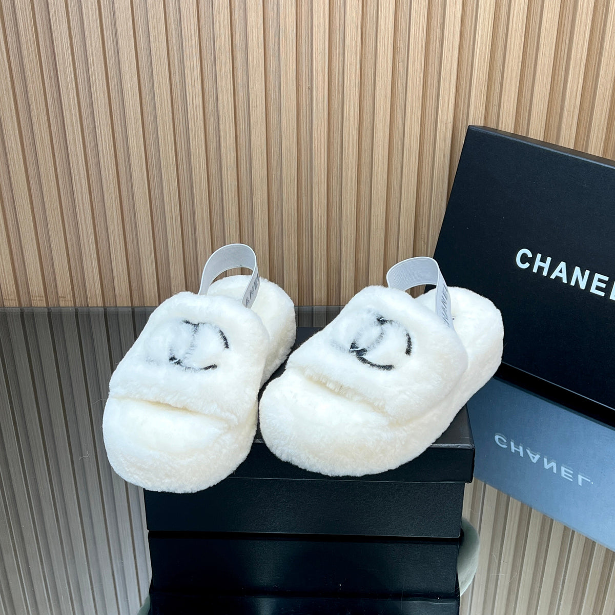 CHANEL 25S THICK-SOLED FURRY SLIPPERS WITH ELASTIC STRAPS IN WHITE FUR