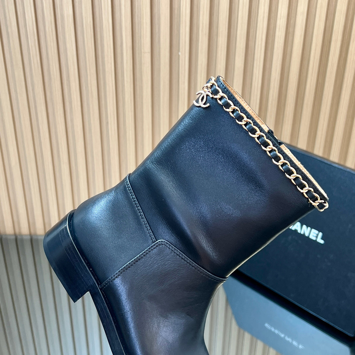 CHANEL 25S SHORT BOOTS WITH CHAIN IN BLACK CALFSKIN