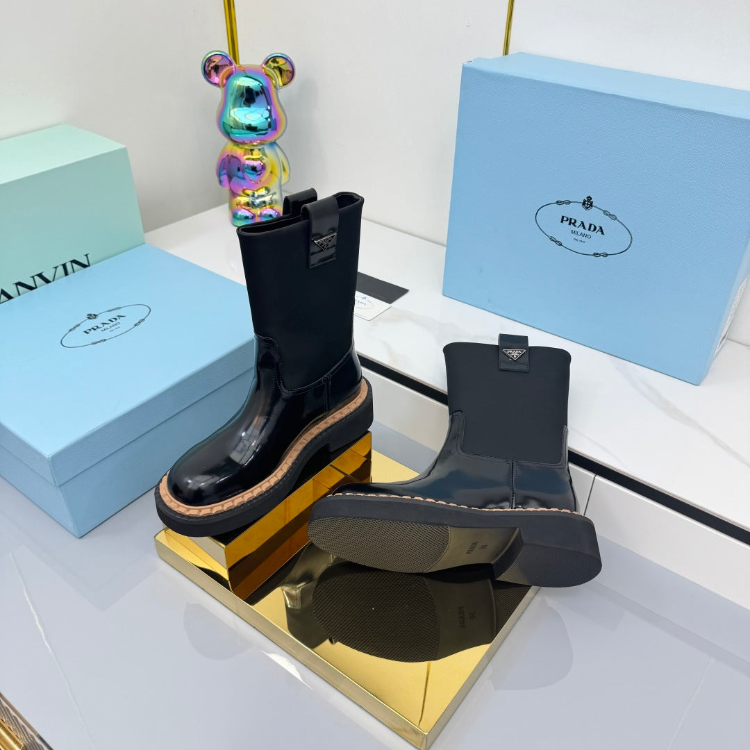 PRADA 25S HIGH MARTIN BOOTS 50MM IN BLACK GLOSSY CALFSKIN