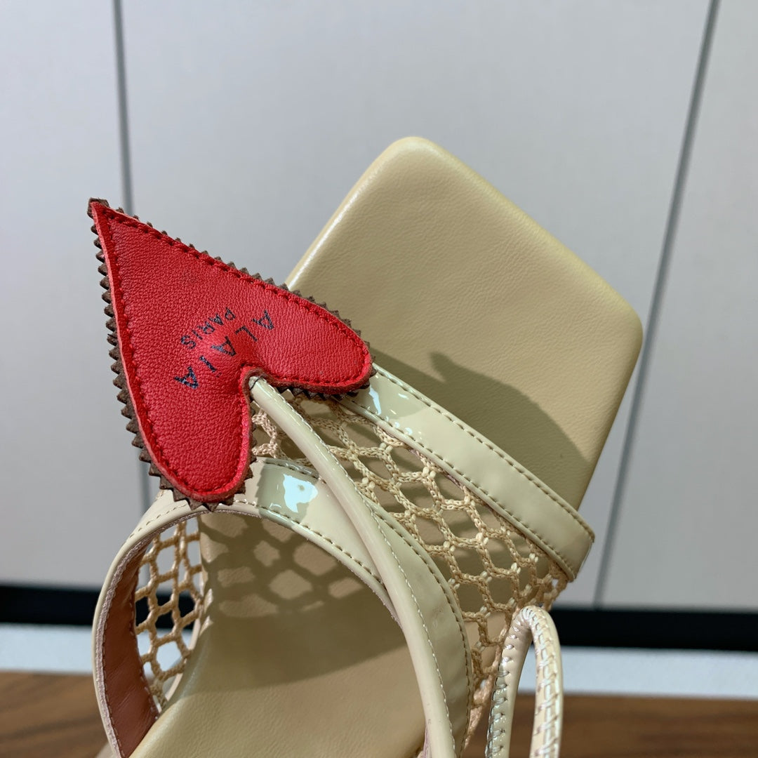 ALAIA BANQUET WEDGE SANDALS IN GOLD LAMBSKIN WITH RED HEART