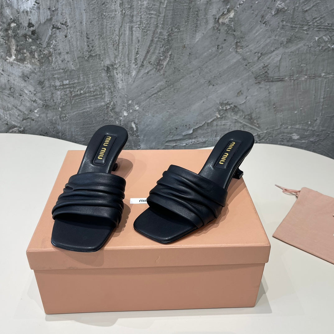 HIGH - HEEL BLACK SHEEPSKIN WITH STYLIZED STRAPS