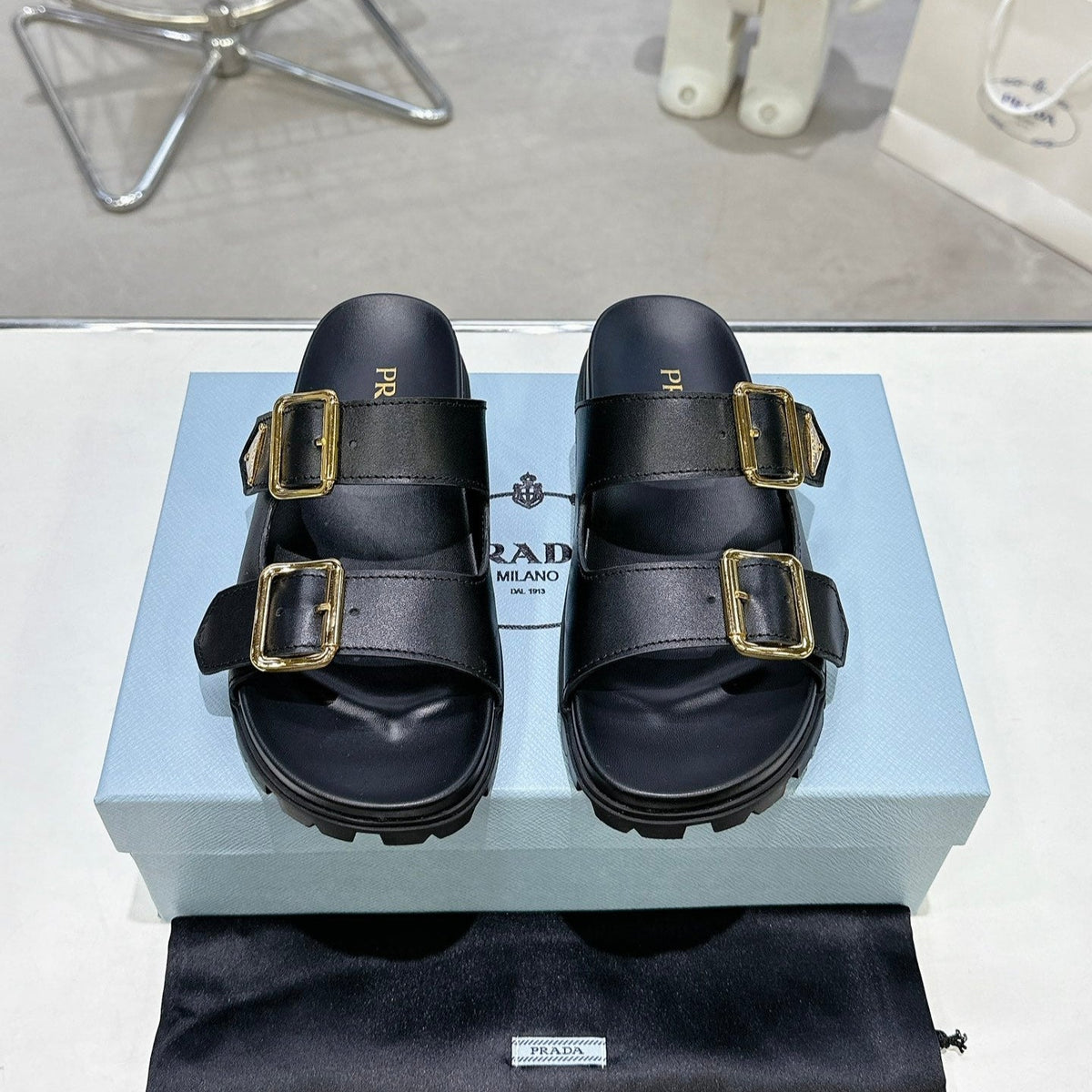 PRADA 25S STRAP SLIDES 30MM IN BLACK CALFSKIN GOLD HARDWARE