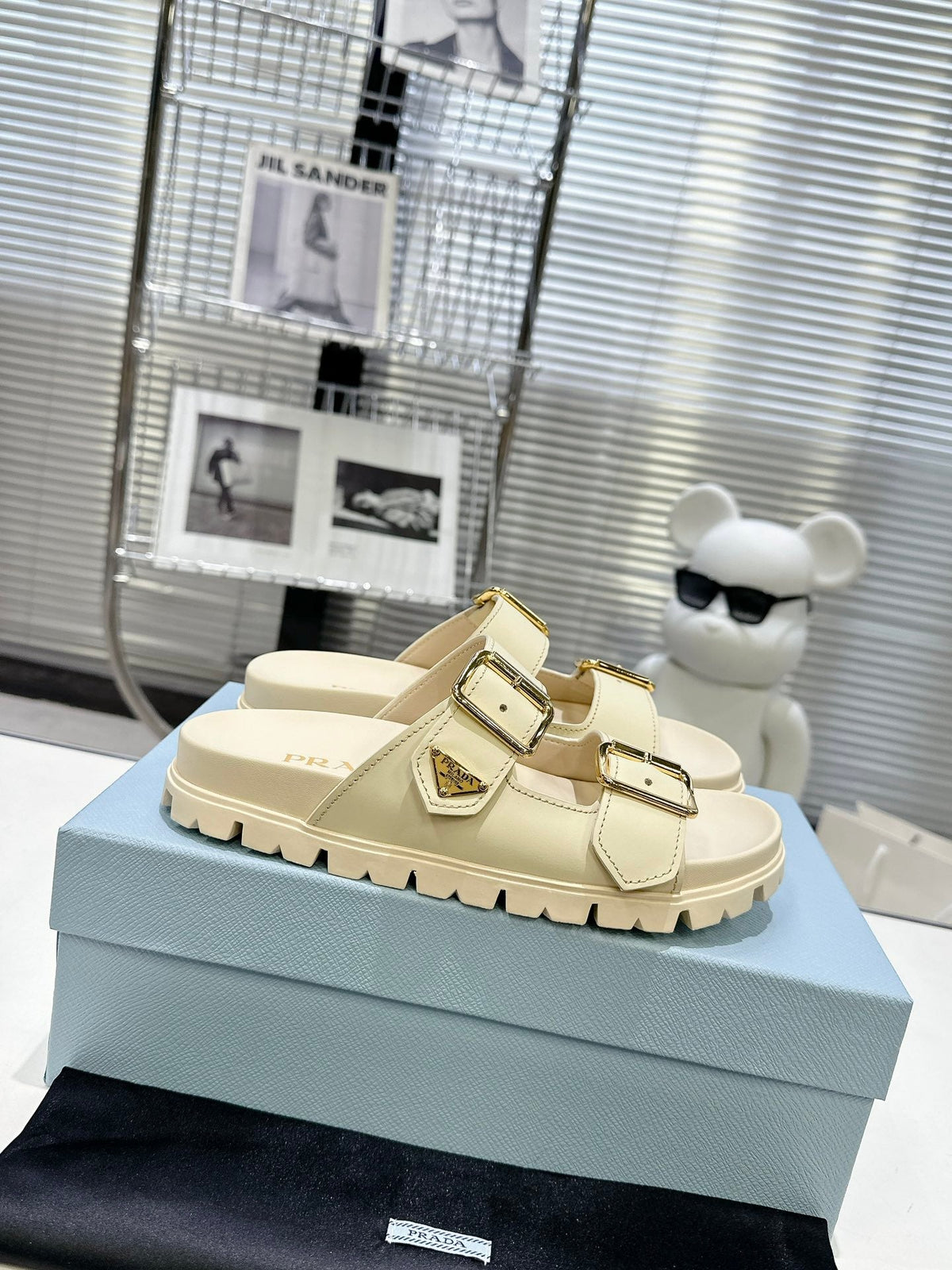 PRADA 25S STRAP SLIDES 30MM IN CREAM CALFSKIN GOLD HARDWARE