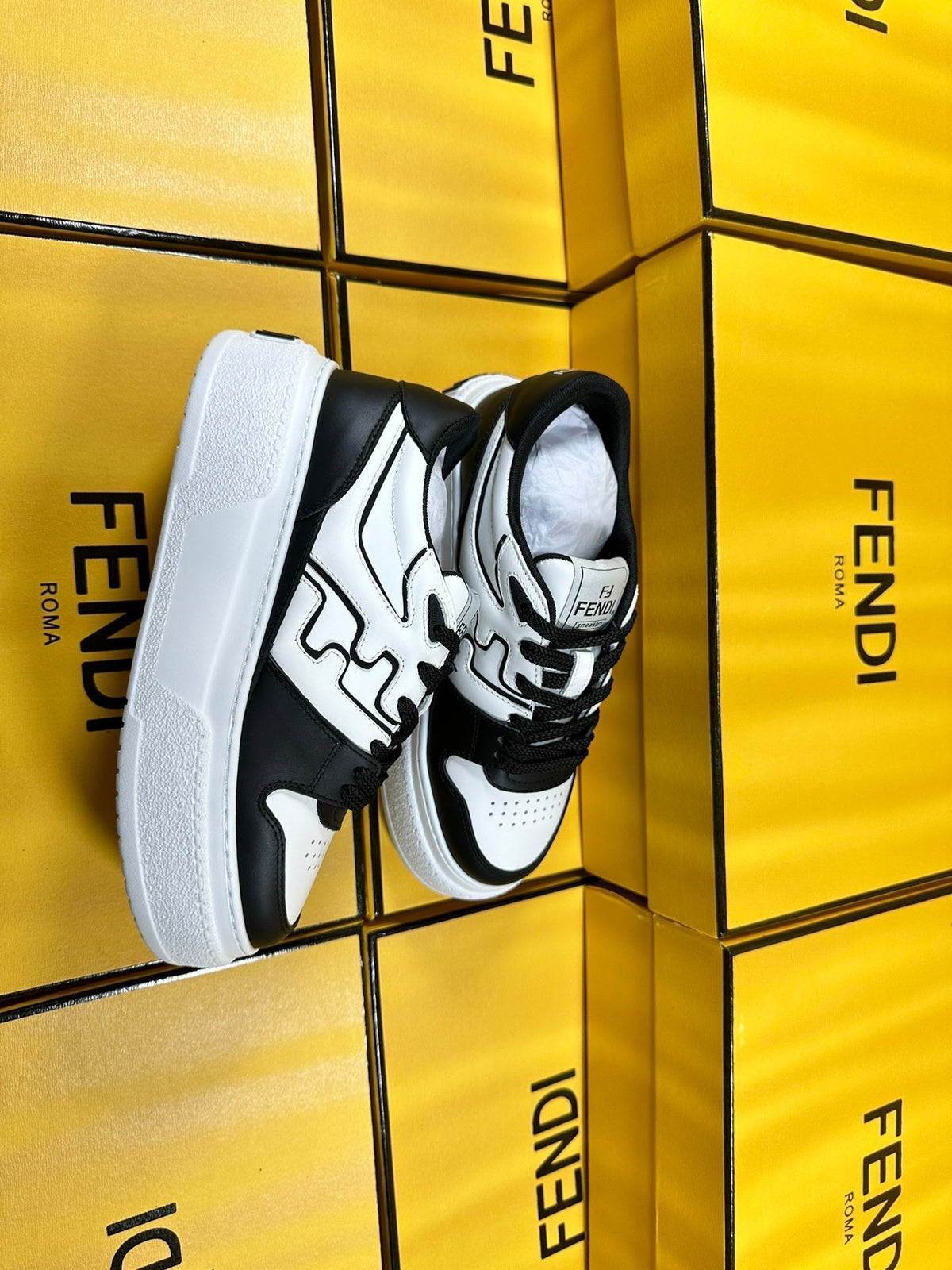 FENDI THICK-SOLDED SNEAKER IN WHITE AND BLACK LAMBSKIN