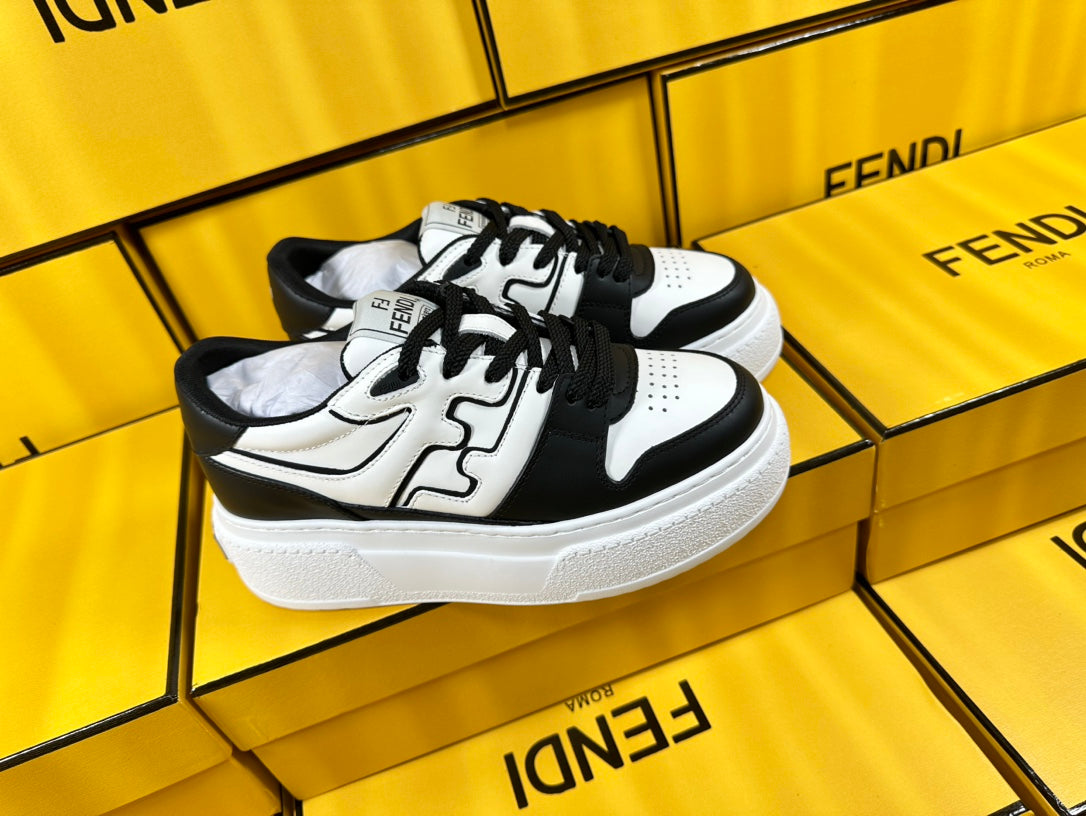 FENDI THICK-SOLDED SNEAKER IN WHITE AND BLACK LAMBSKIN
