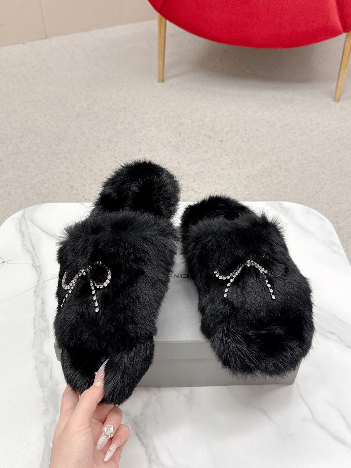 BALENCIAGA 25S SOFT FUR SLIPPERS IN BLACK FUR WITH RHINESTONE BOW