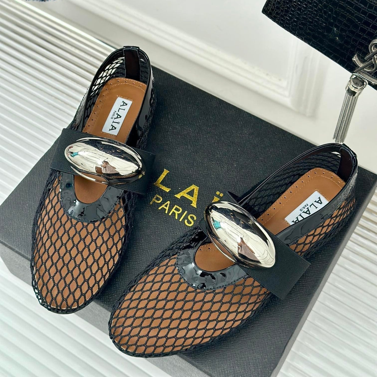 ALAIA MARY JANE SHOES IN BLACK MESH WITH SILVER HARDWARE