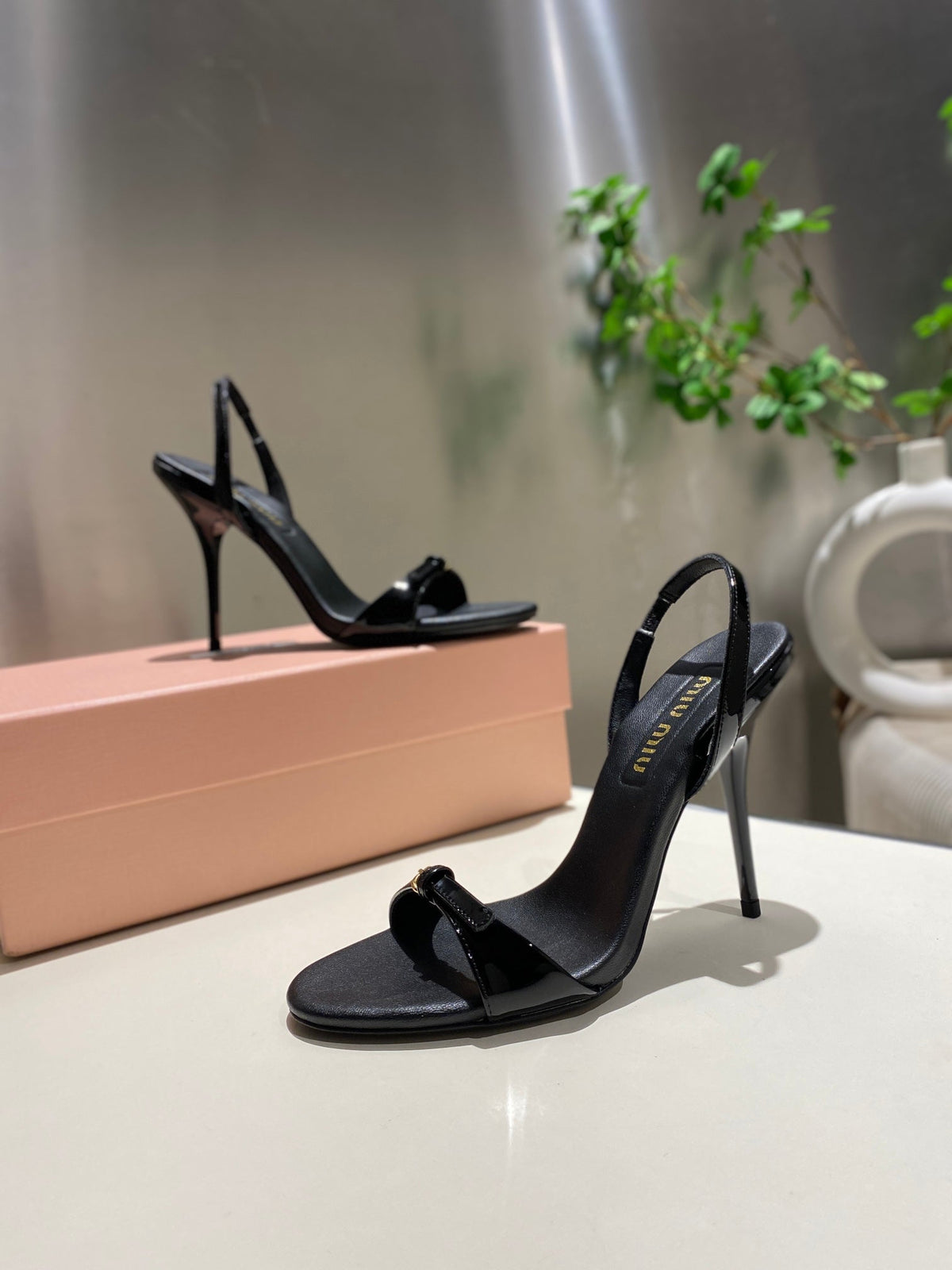 TWO STRAP HIGH HEELED SANDALS IN BLACK GLOSSY SHEEPSKIN