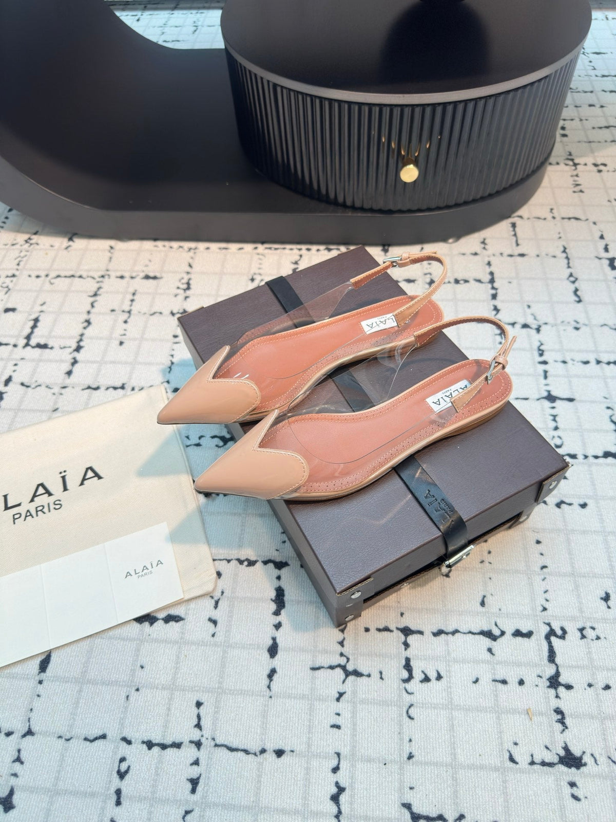 ALAIA FLAT SLINGBACK IN BEIGE BISQUE PATENT CALFSKIN AND FILM