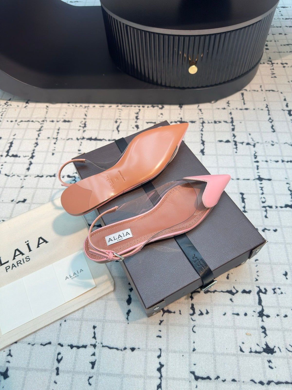 ALAIA FLAT SLINGBACK IN ROSE PINK PATENT CALFSKIN AND FILM