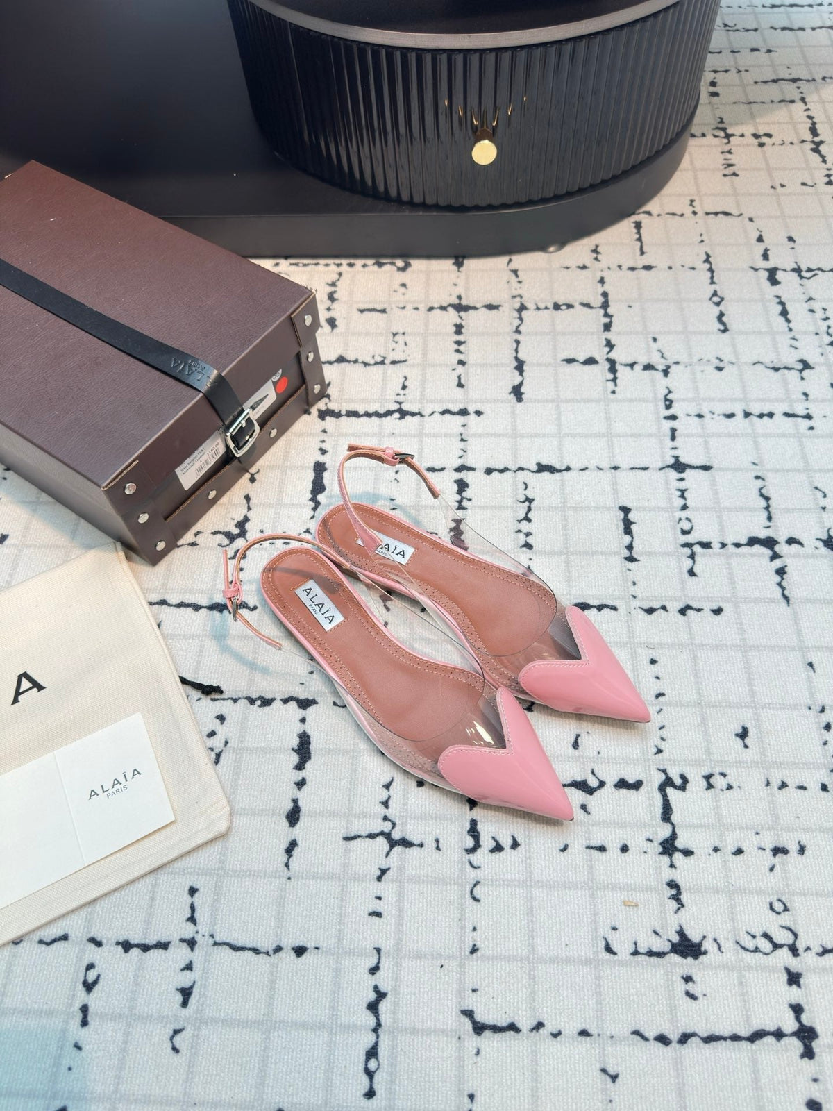 ALAIA FLAT SLINGBACK IN ROSE PINK PATENT CALFSKIN AND FILM