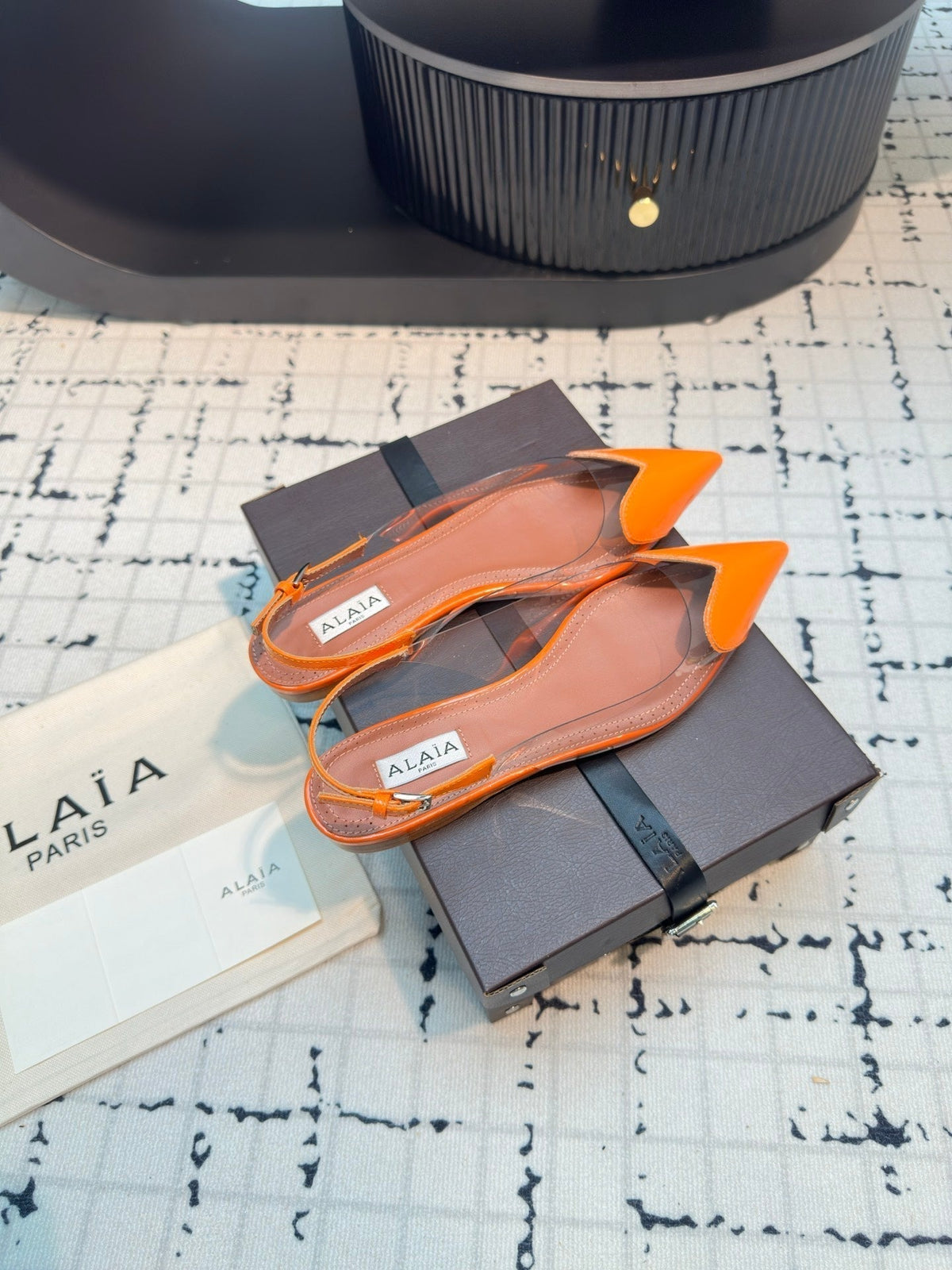 ALAIA FLAT SLINGBACK IN TIGER ORANGE PATENT CALFSKIN AND FILM