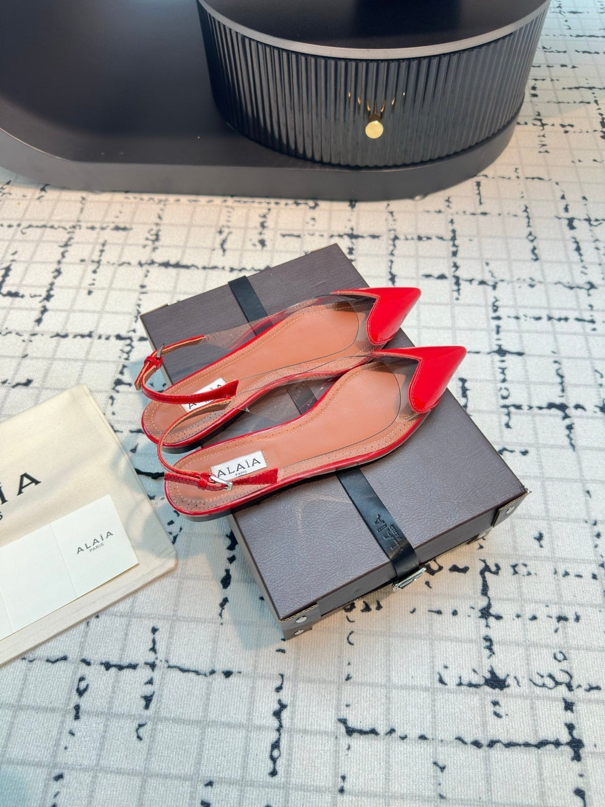 ALAIA FLAT SLINGBACK IN CHERRY RED PATENT CALFSKIN AND FILM