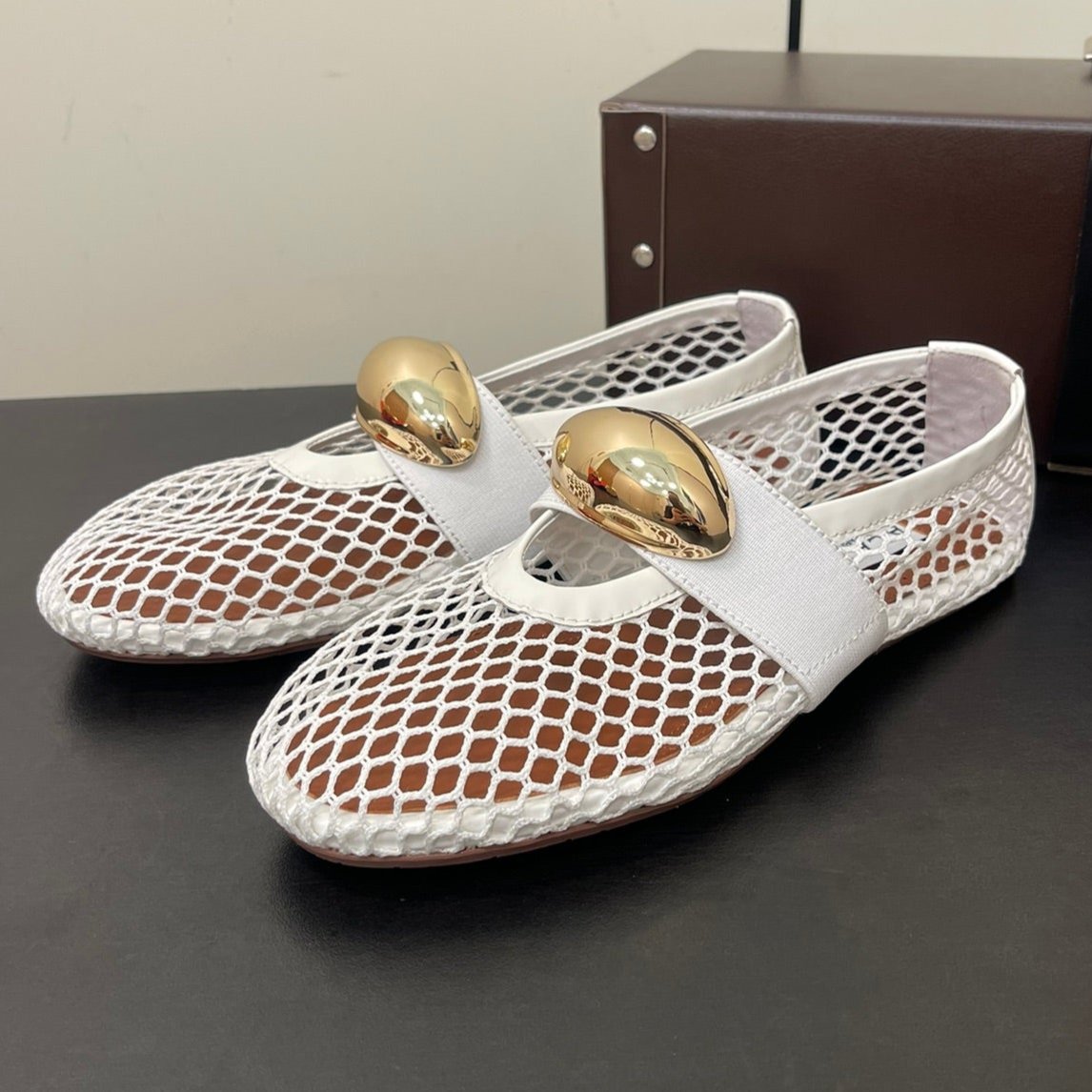 ALAIA BALLET FLATS IN WHITE MESH FISHNET WITH GOLD HARDWARE