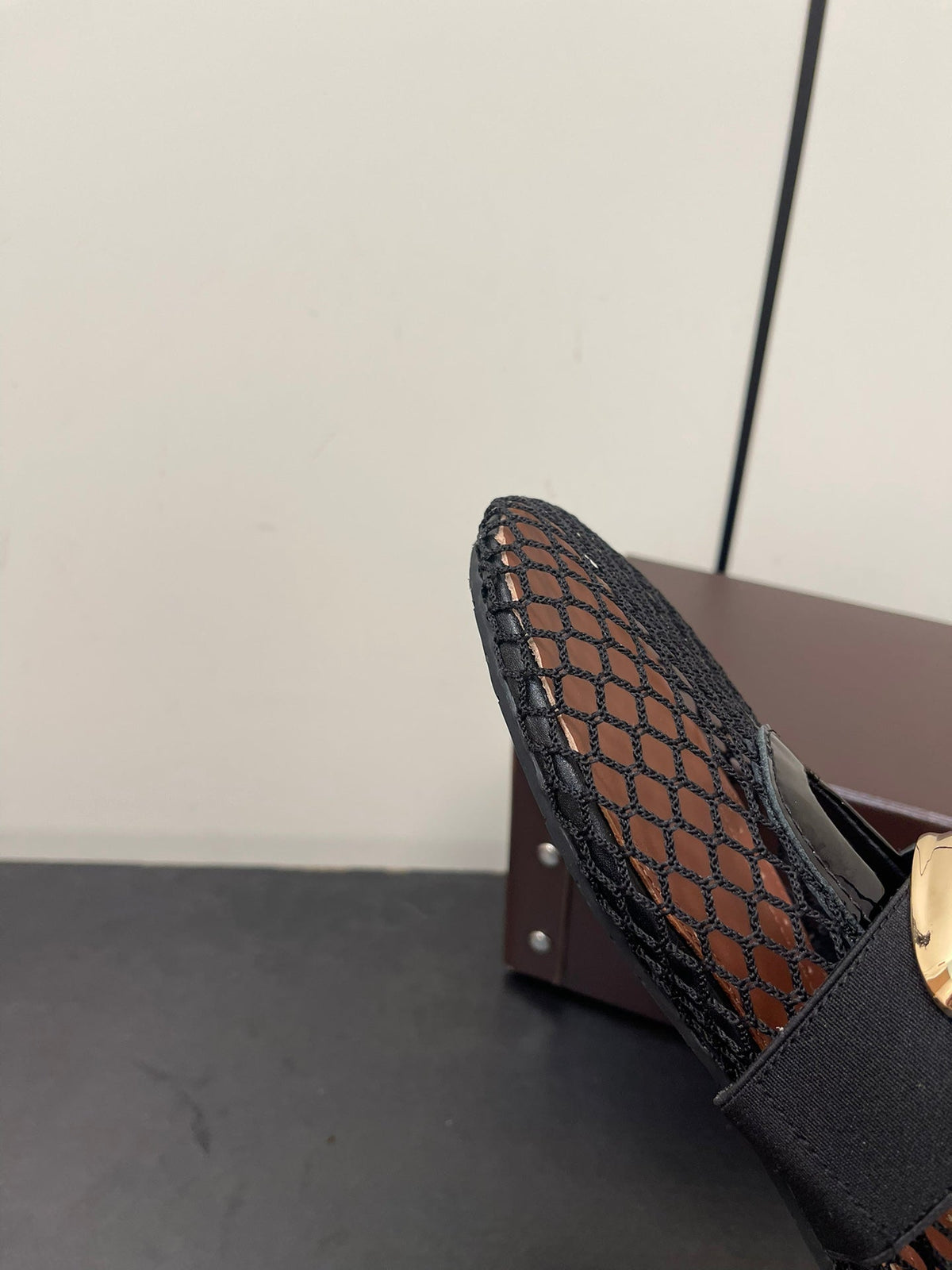 ALAIA BALLET FLATS IN BLACK MESH FISHNET WITH GOLD HARDWARE