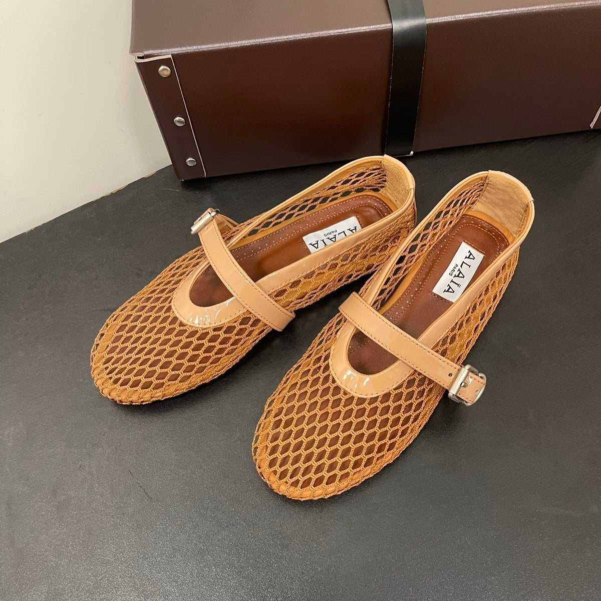 ALAIA BALLET FLATS IN COPPER BROWN MESH FISHNET