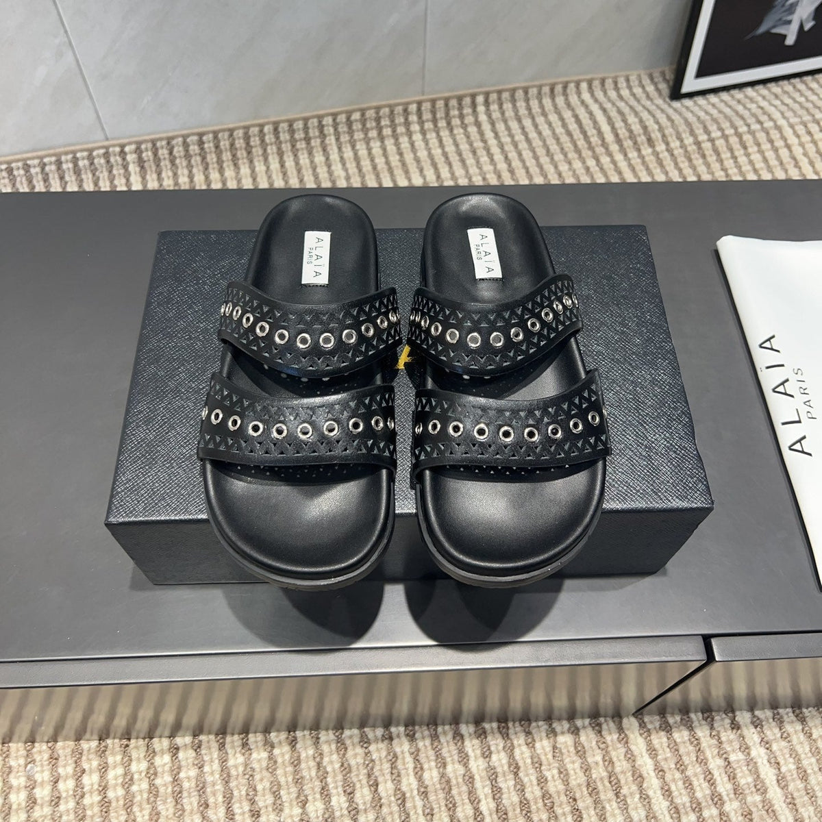 ALAIA DOUBLE-STRAP SANDALS 25S IN BLACK CALFSKIN