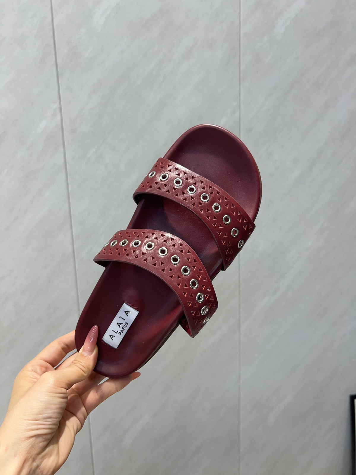 ALAIA DOUBLE-STRAP SANDALS 25S IN DARK RED CALFSKIN