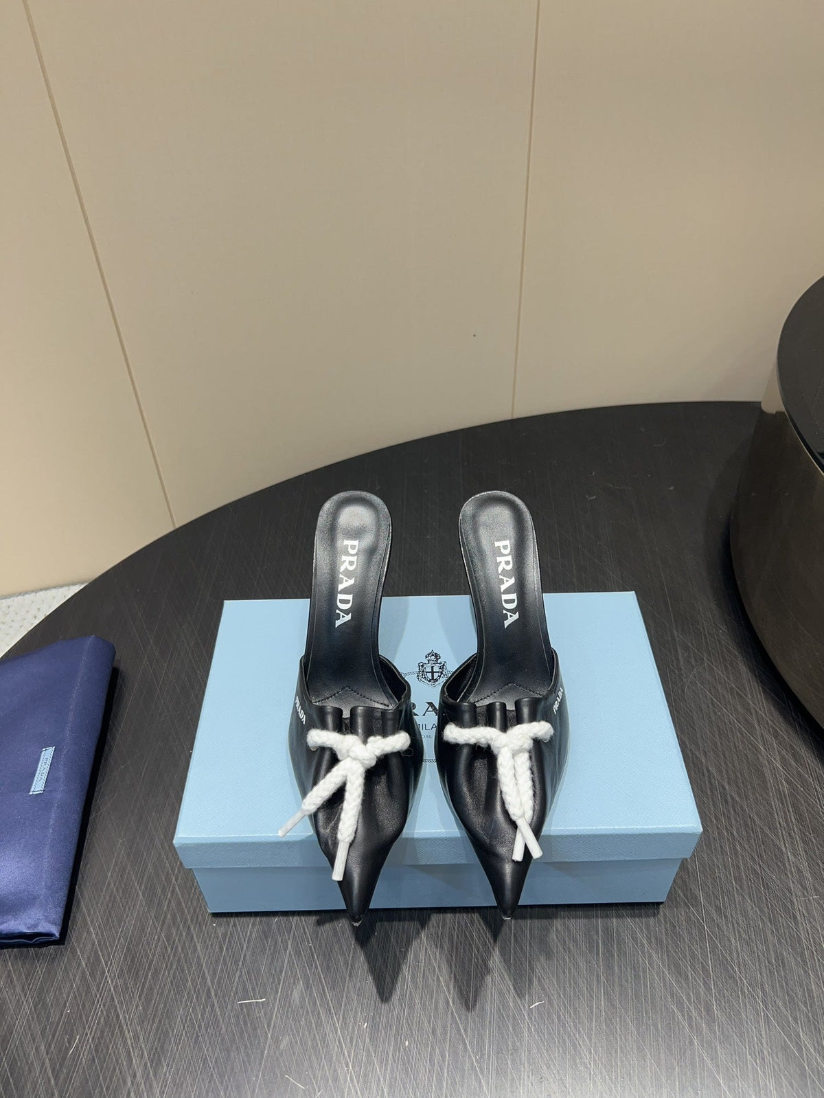 PRADA 25S BRAIDED DETAIL MULES 85MM IN BLACK CALFSKIN