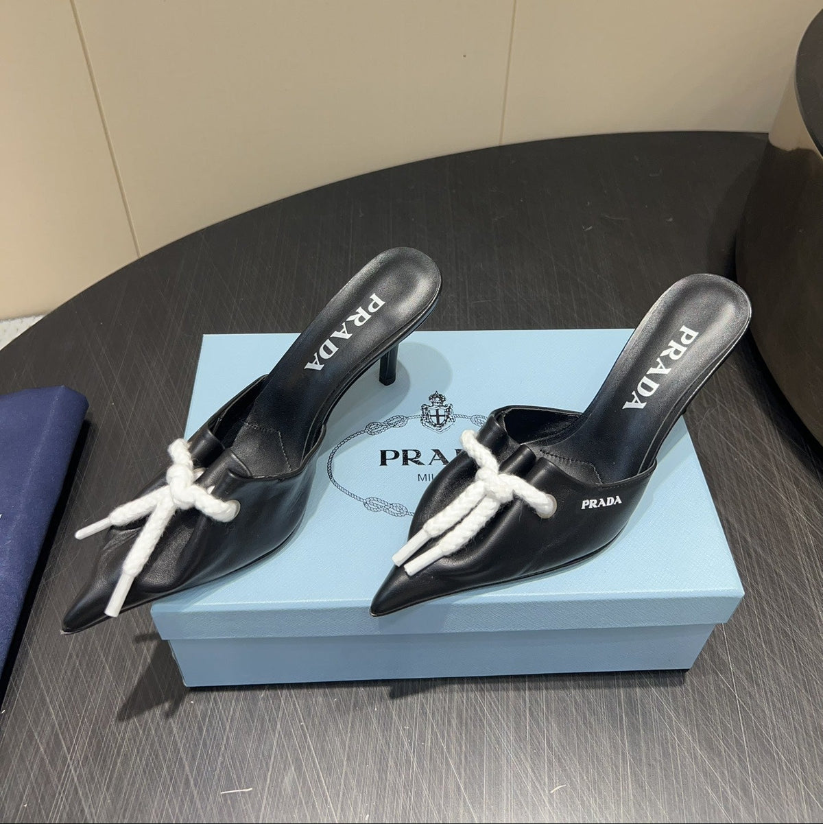 PRADA 25S BRAIDED DETAIL MULES 85MM IN BLACK CALFSKIN
